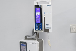 A medical infusion pump with a monitor, showcasing advanced technology by the Shree Danev Foundation.