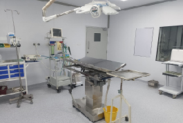 A hospital room featuring advanced medical equipment, showcasing the Shree Danev Foundation's modular operation theater design.