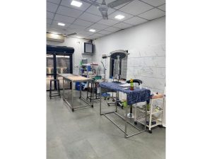 Interior of a room with a table and chairs, located in the general ward of the Shree Danev Foundation's animal hospital.