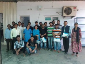 A group of individuals at the Shree Danev Foundation during the Save Birds Campaign 2019 in a factory setting.